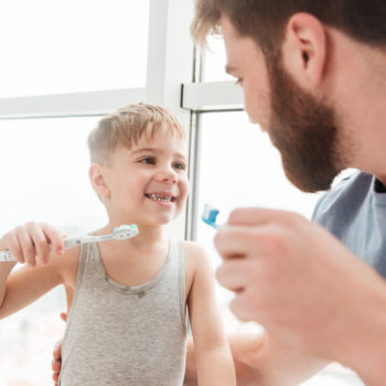 Father Teaching Child to Bruch His Teeth