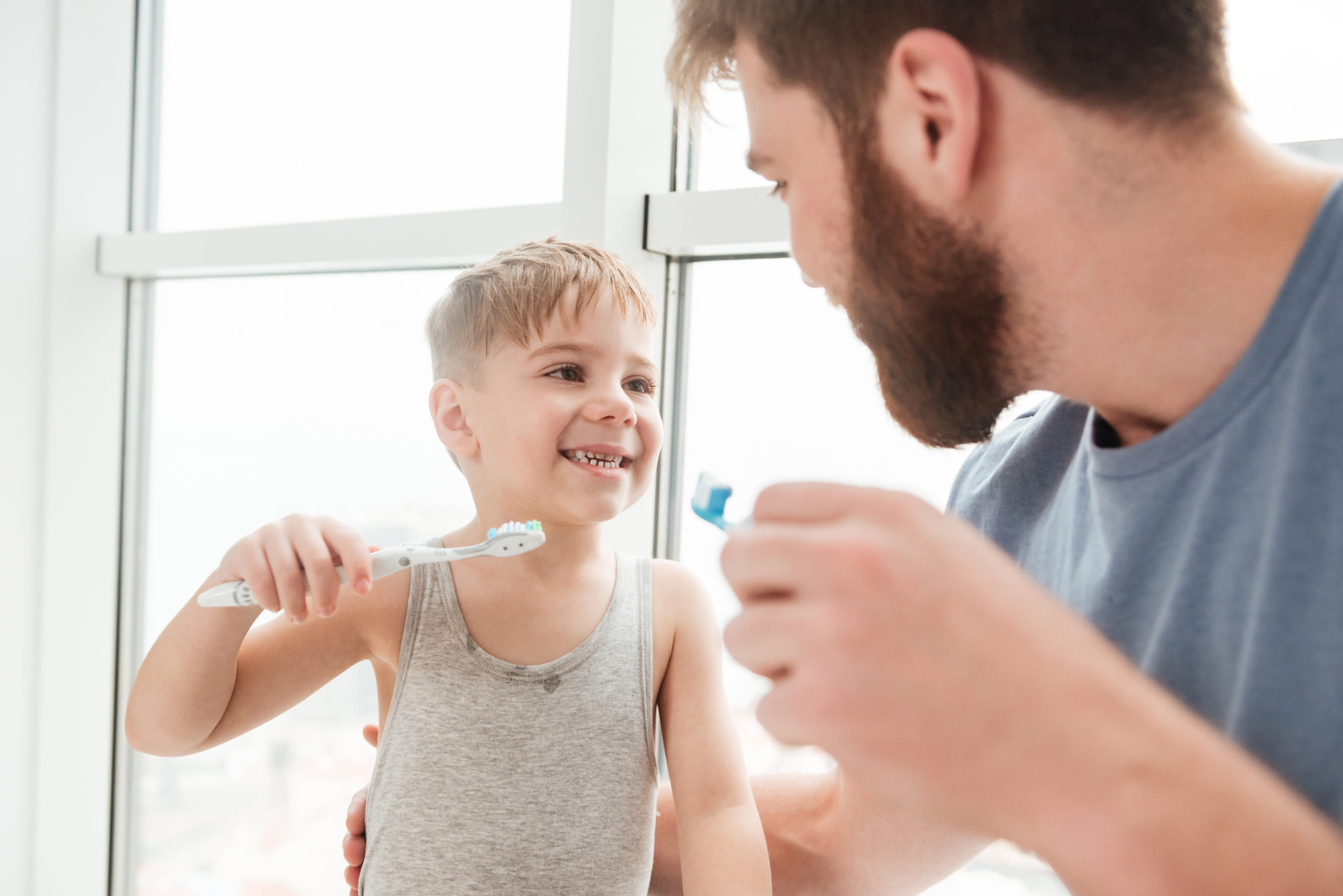 Father Teaching Child to Bruch His Teeth